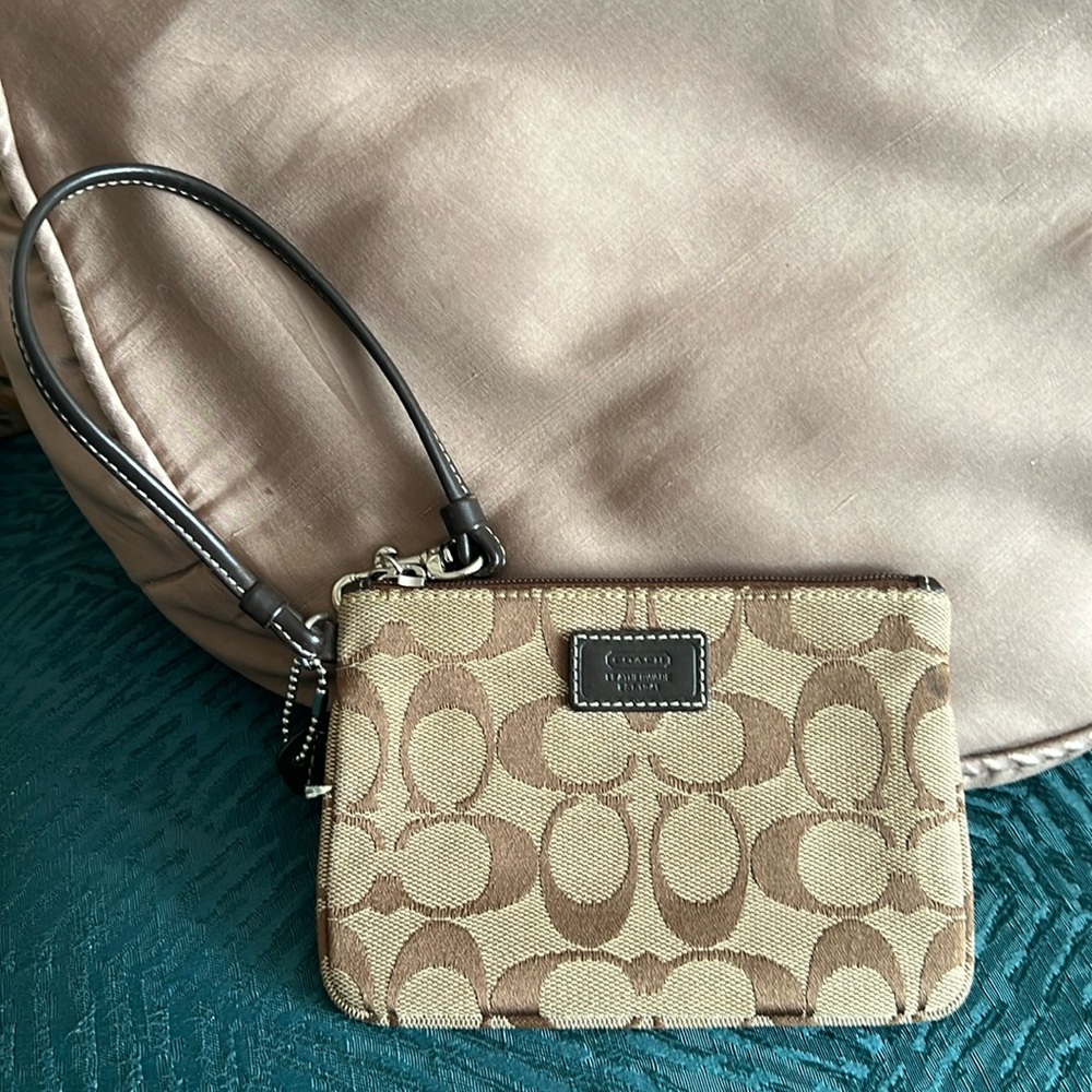 COACH : Wristlet.  C signature design in brown and tan colors.